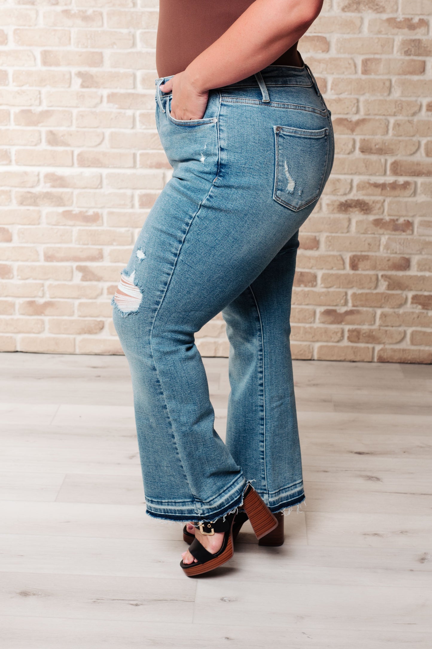 Judy Blue-Isla Mid Rise Distressed Released Hem Bootcut Jeans