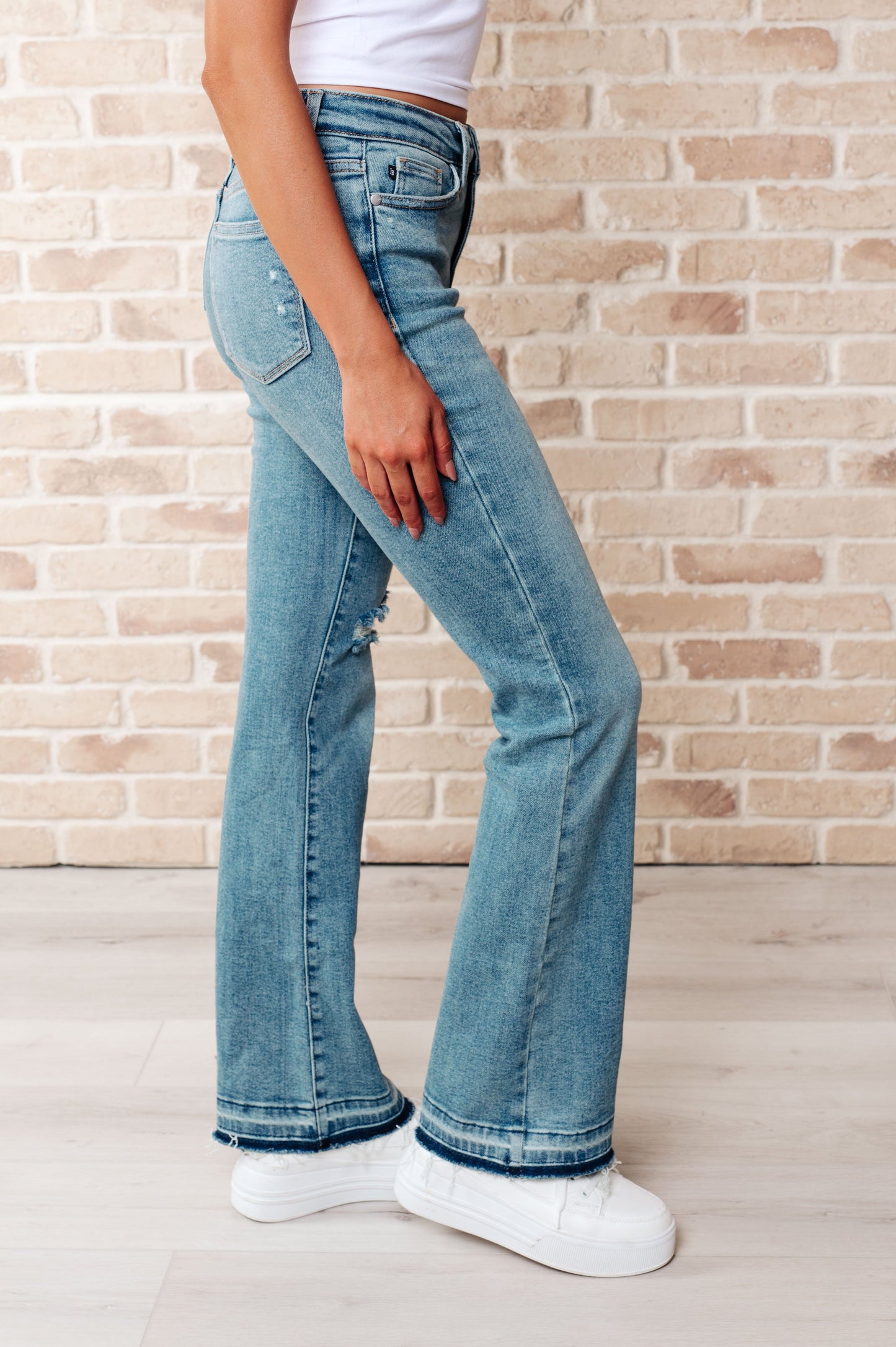 Judy Blue-Isla Mid Rise Distressed Released Hem Bootcut Jeans